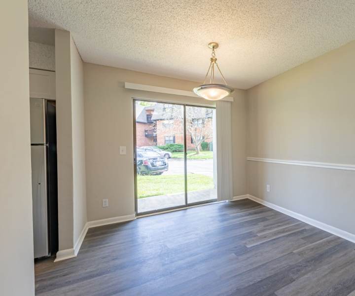 Access to patio through glassdoor at Huffman Mill Townhomes in Burlington, North Carolina