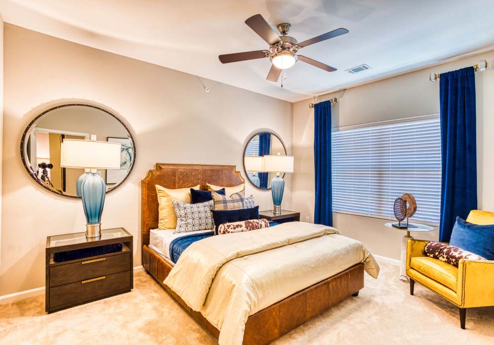 Carpeted bedroom with plenty of space at Hollybrook Ranch in Round Rock, Texas