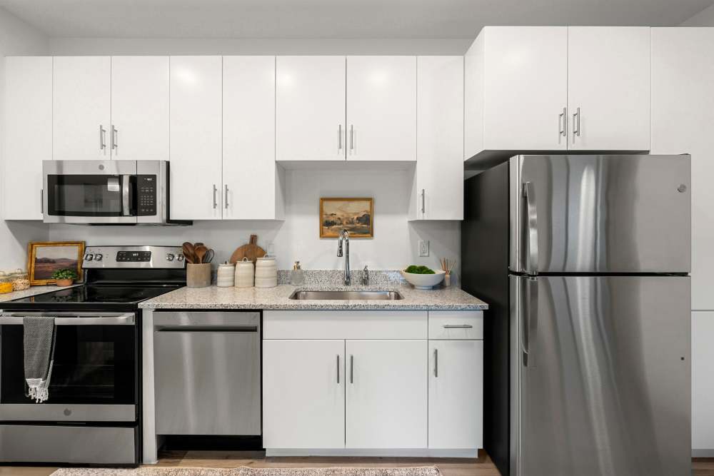 Kitchen with granite countertop at Olympus at Arroyo Verde in Tucson, Arizona