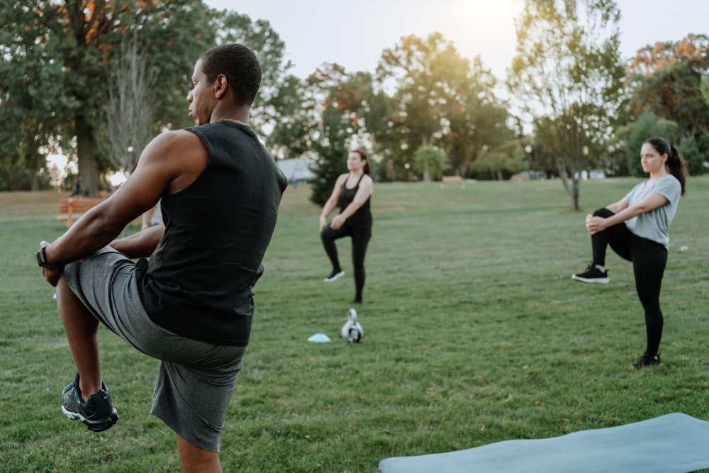 Residents stretching before a group workout at New Barn Apartments in Miami Lakes, Florida