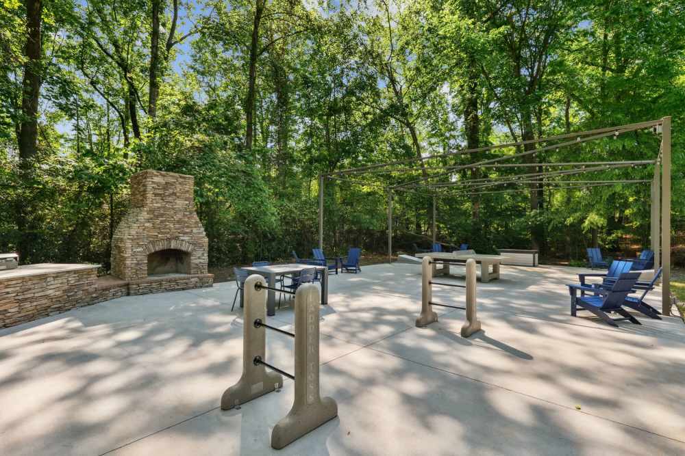 Outdoor fireplace area with seating at Stillwater in Charlotte, North Carolina