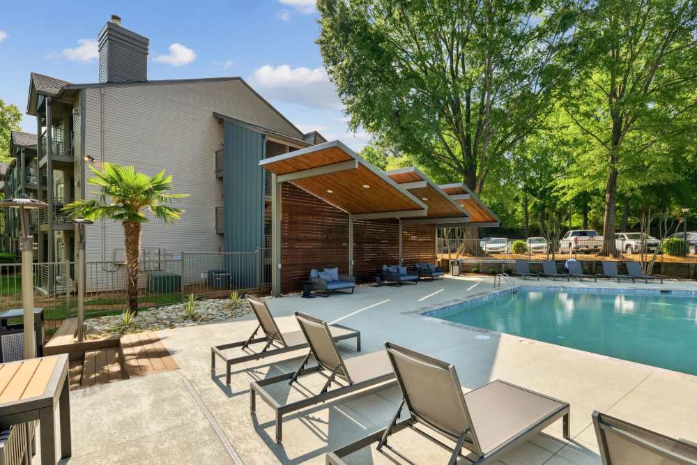 Swimming pool with sun deck and lounge chairs at Stillwater in Charlotte, North Carolina