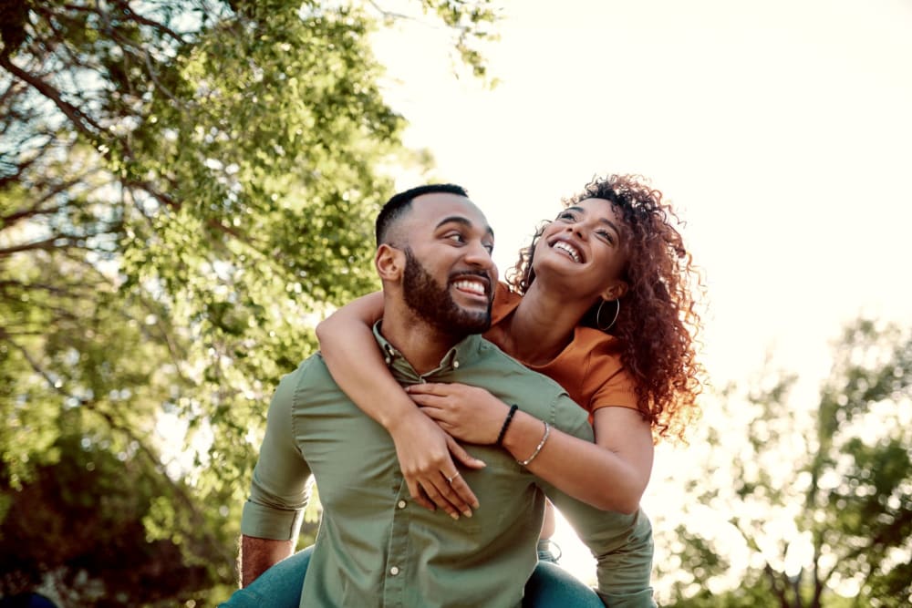 Happy residents at a park near Mission Apartments in San Diego, California