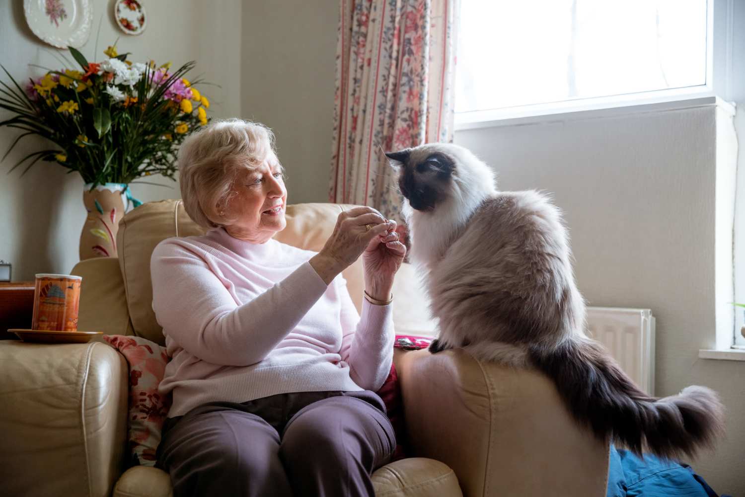 Resident with her pet at Harmony in Las Vegas, Nevada
