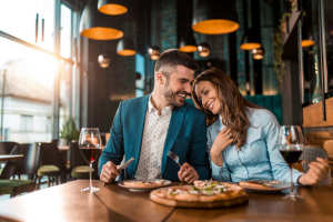 Resident couple having lunch at a restaurant near The Gardens At Duncan Apartments in Duncan, Oklahoma