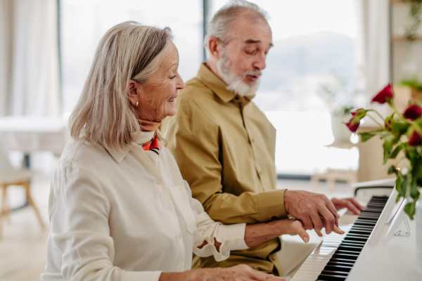 Resident couple playing piano at The Birches at New Hope in New Hope, Pennsylvania