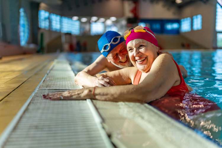 Seniors swimming in the pool at Watermere Highlands in Arlington, Texas