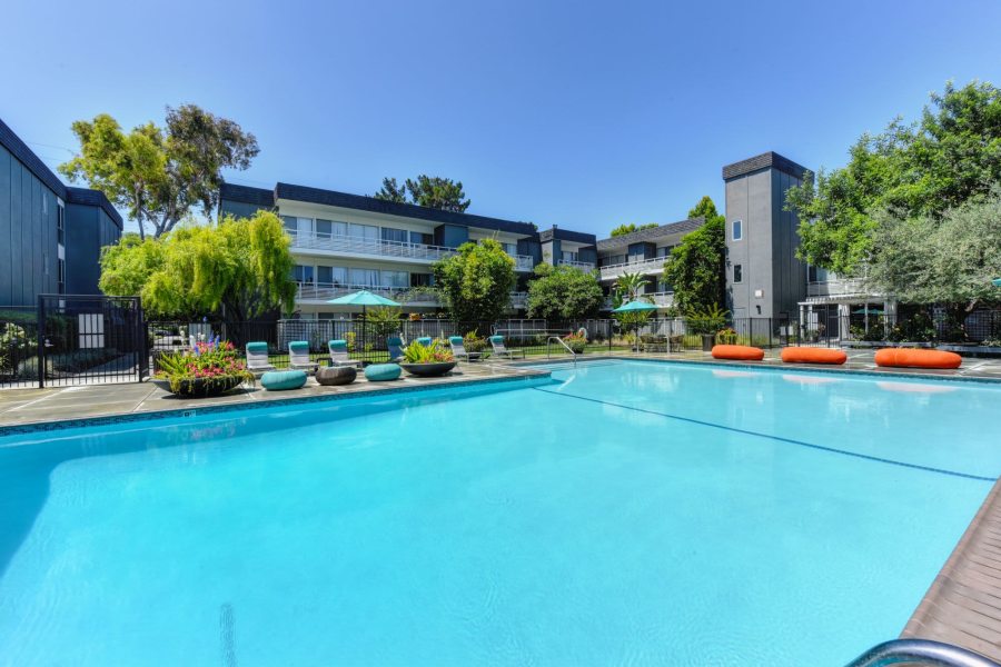 Deck chair around outdoor swimming pool at Citra in Sunnyvale, California