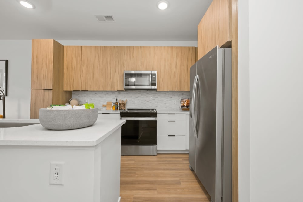 Gourmet kitchen with an island and stainless-steel appliances at The Scottie in Nashville, Tennessee