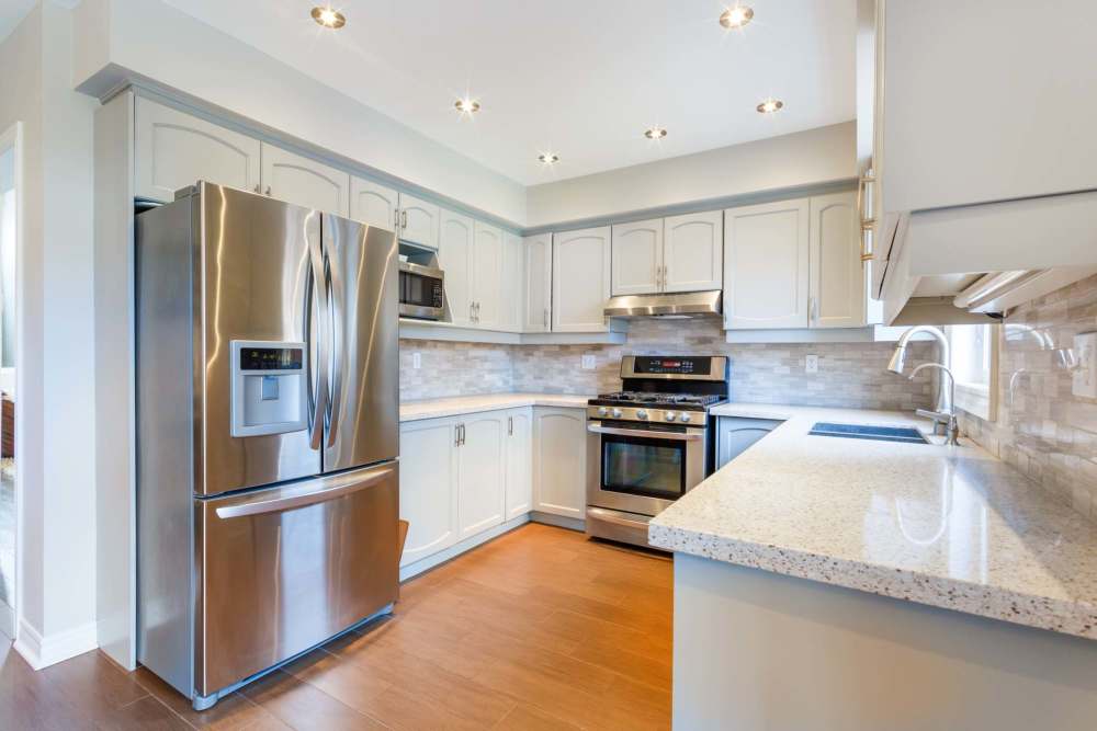 Modern kitchen with stainless-steel appliances at The Commons in Cincinnati, Ohio