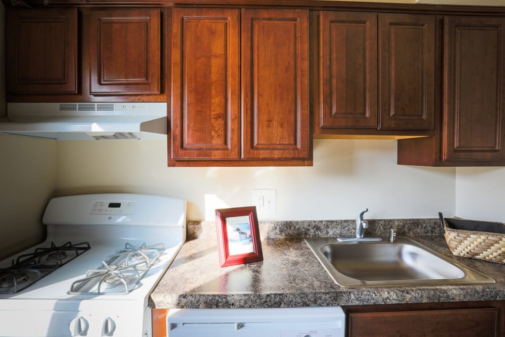 A kitchen with white appliances at Regency Pointe in Forestville, Maryland