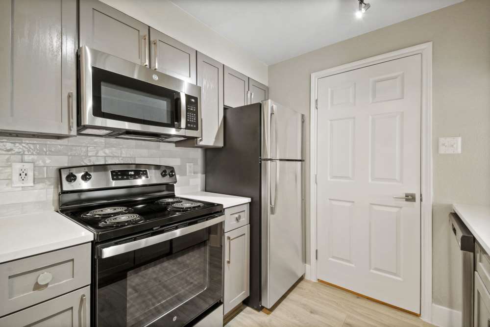 Kitchen with stainless-steel appliances at Cayman, Universal City, Texas