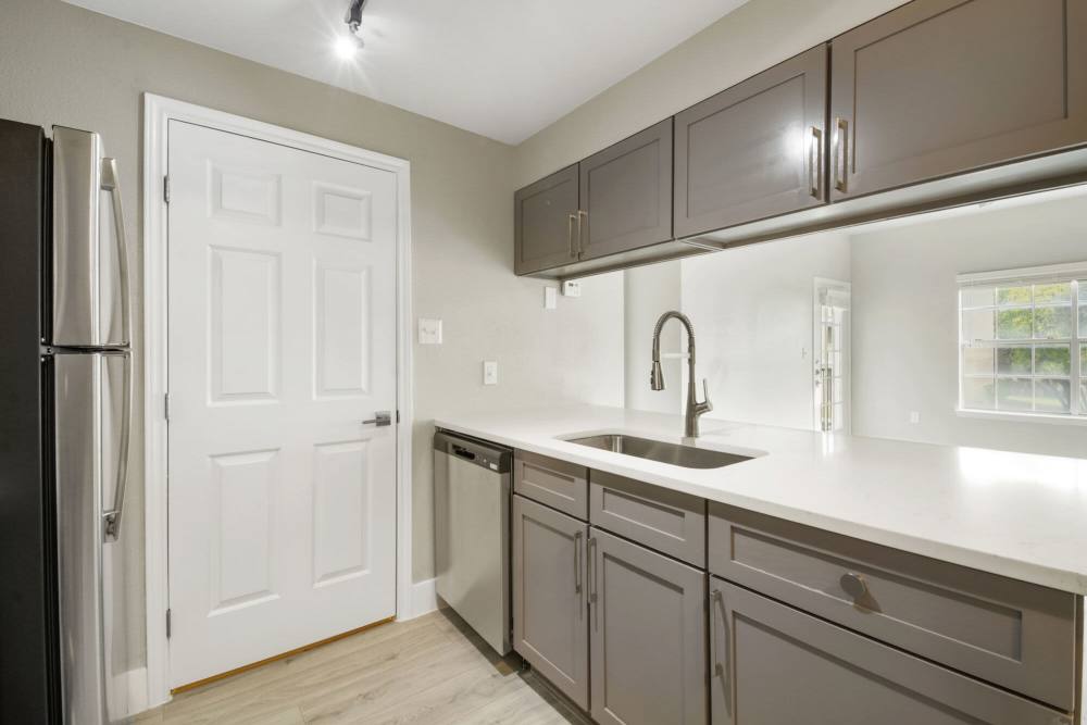 Kitchen with wooden cabinets at Cayman, Universal City, Texas