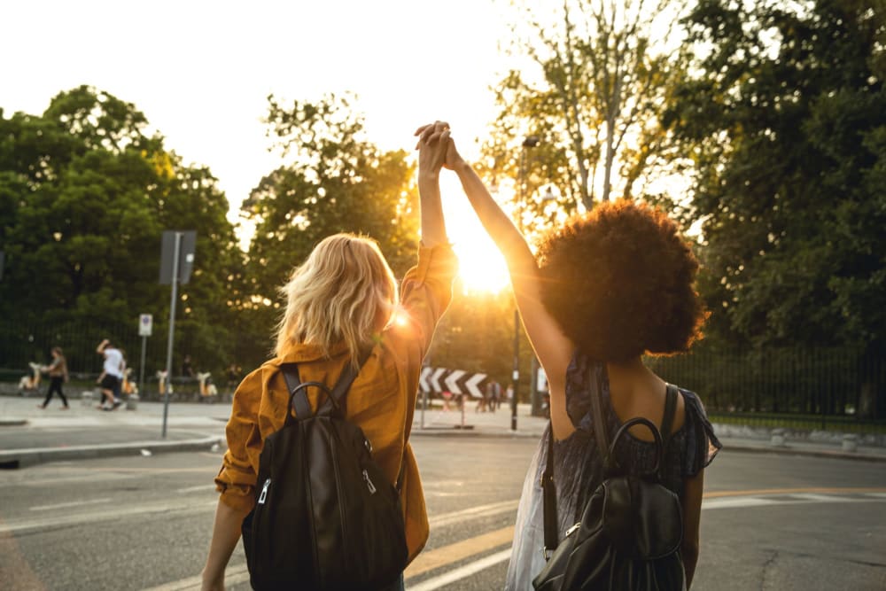 Residents holding hands at Royal Village Apartments in San Diego, California