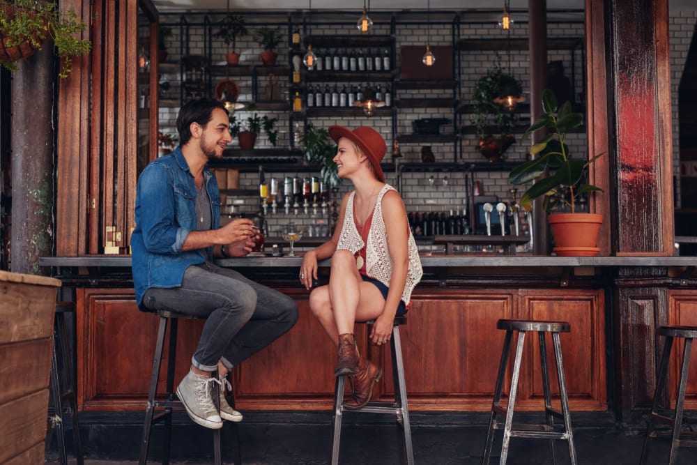 Resident couple enjoying lunch together at their favorite restaurant near Royal Village Apartments in San Diego, California
