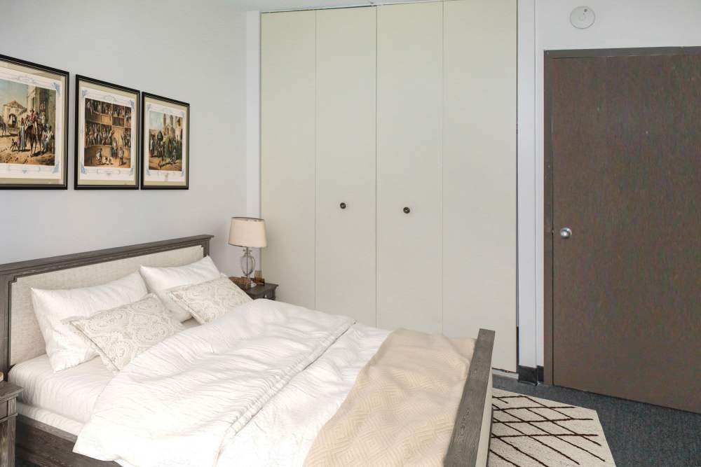Bedroom with a comfortable bed at Fairhaven Village in Fairhaven, Massachusetts