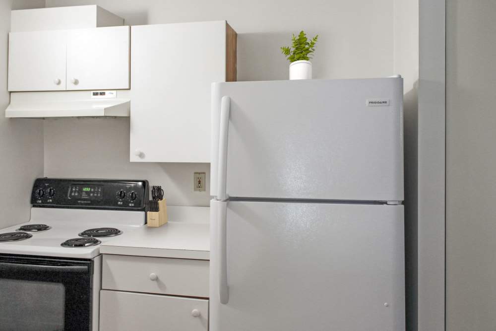Kitchen with refrigerator at Fairhaven Village in Fairhaven, Massachusetts