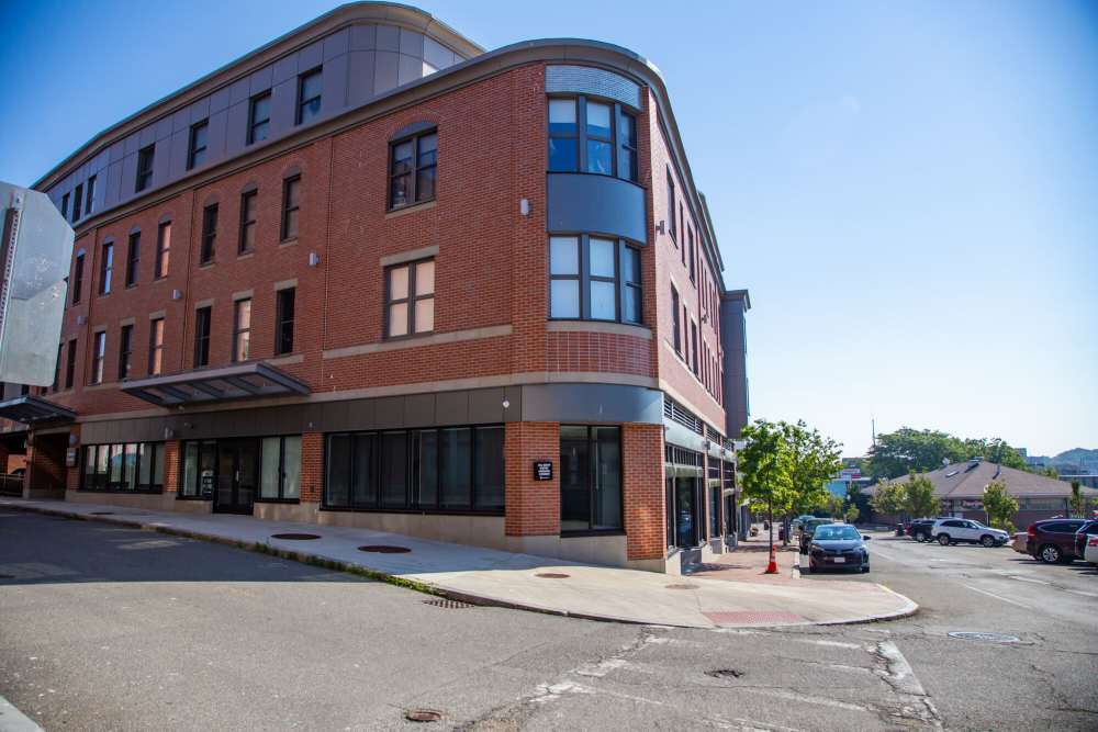 Exterior view of the apartment building at Harbor Village in Gloucester, Massachusetts