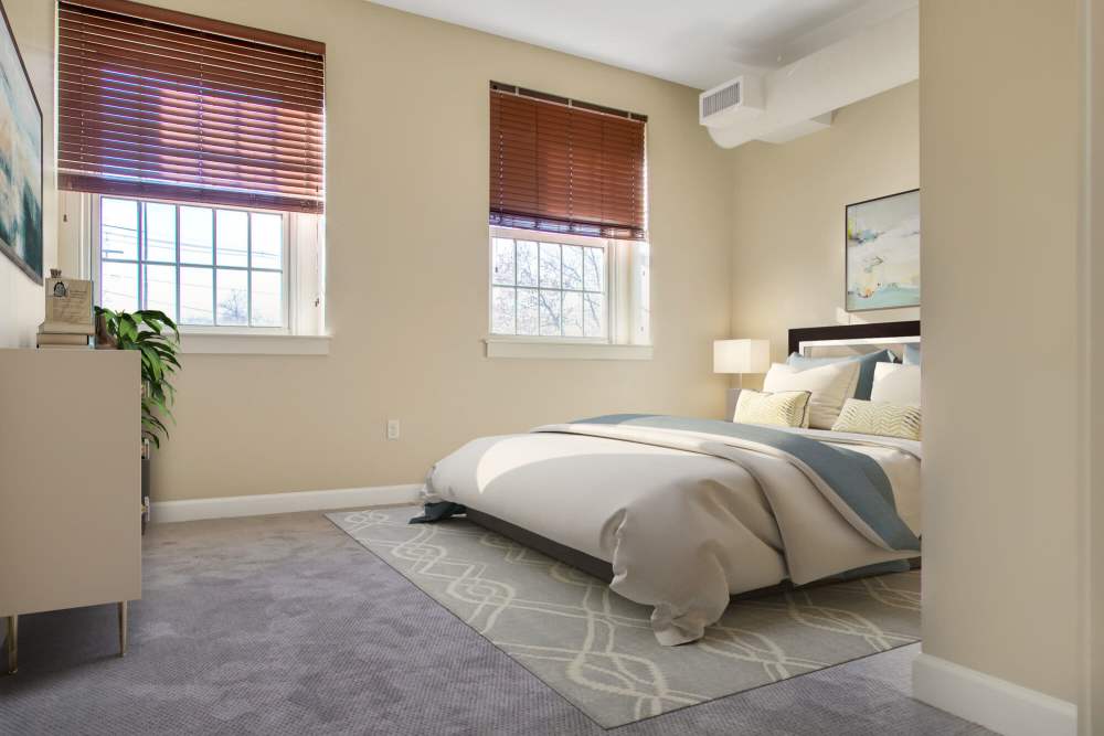 Spacious bedroom with large window and air conditioning at The Residences at Towne School in Acton, Massachusetts
