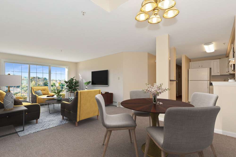 Comfortable living area with dining space at Stony Brook Village in Westford, Massachusetts
