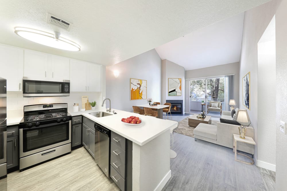 Kitchen with an island and stainless-steel appliances at The Retreat in Santa Clarita, California  