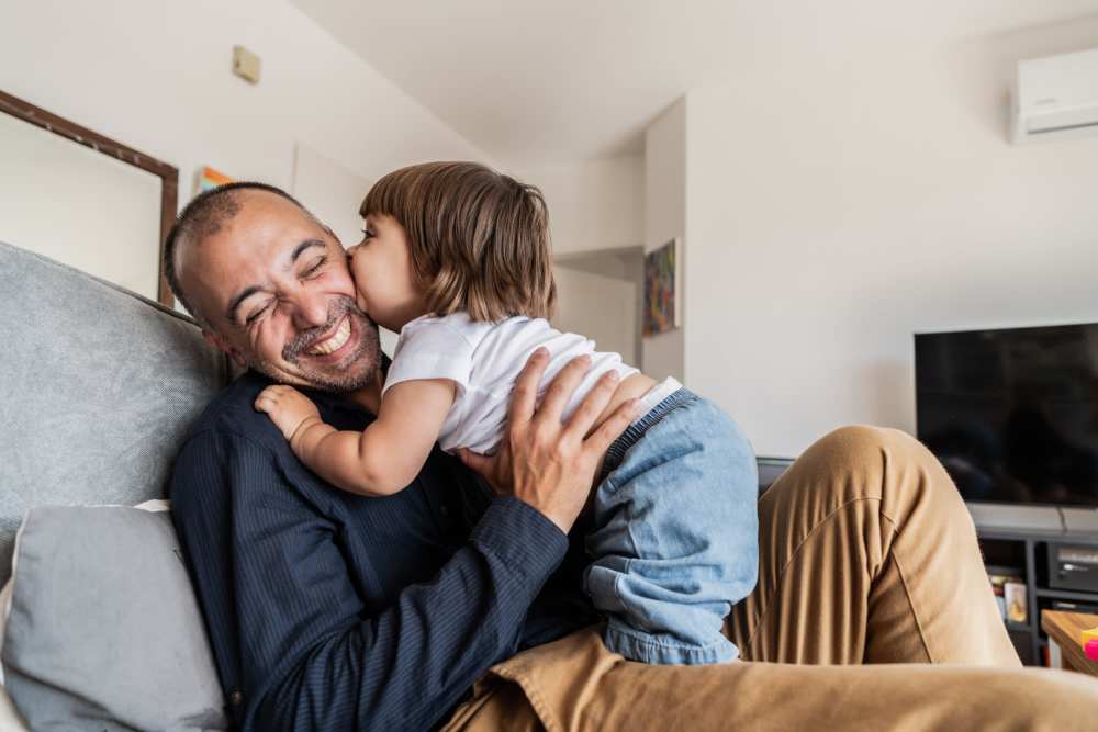 Resident with his baby at Canyon Townhomes in Phoenix, Arizona