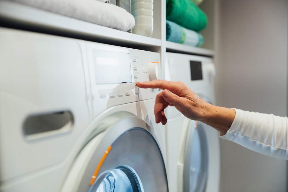 Community laundry room with washer and dryer at The Acacia in Palo Alto, California