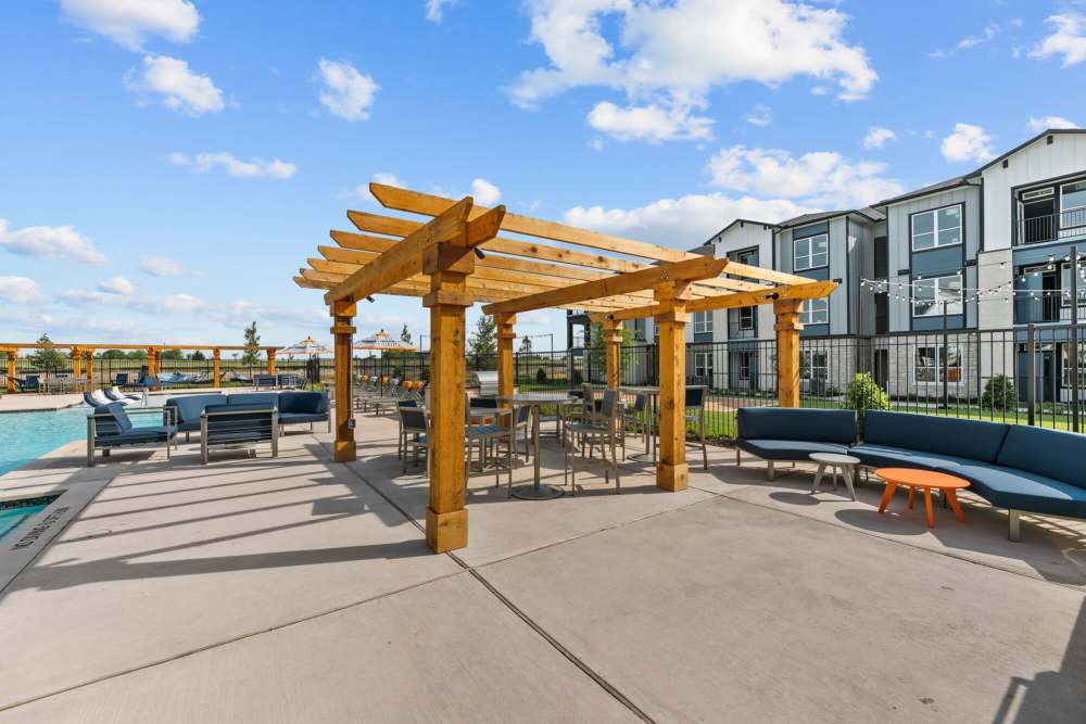 Pergola with outdoor grills seating at The Summit at Walnut Creek in Alvarado, Texas