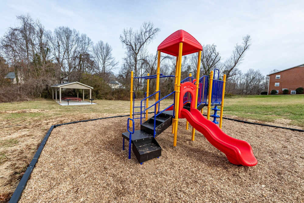 Kids playground with slides at Lofts At Glenhaven in Winston Salem, North Carolina