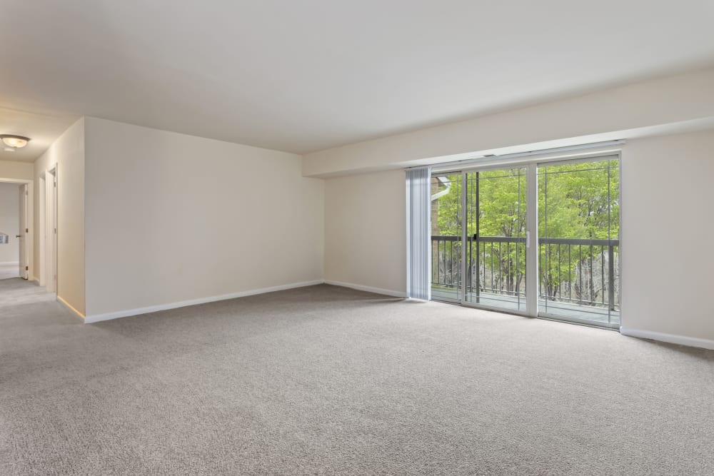 Open space living room with private balcony at Creekside Village in Alexandria, Virginia