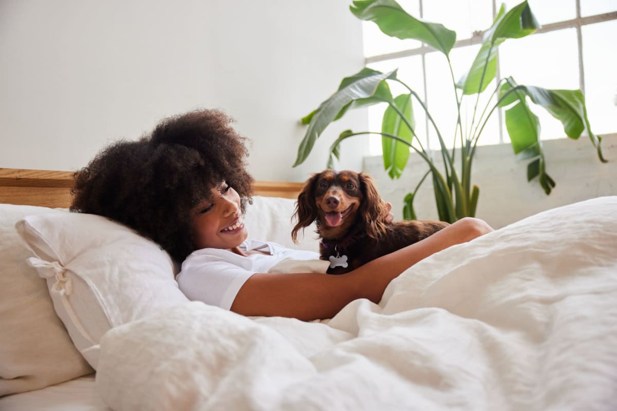 Resident snuggling with their dog at Parallel 36 at Legacy in Opelika, Alabama