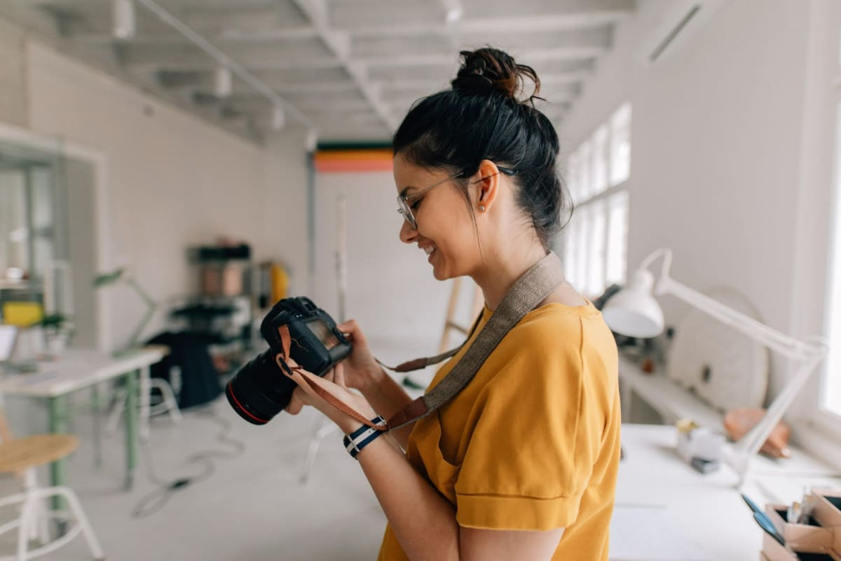 Resident holding her camera at a nearby office 