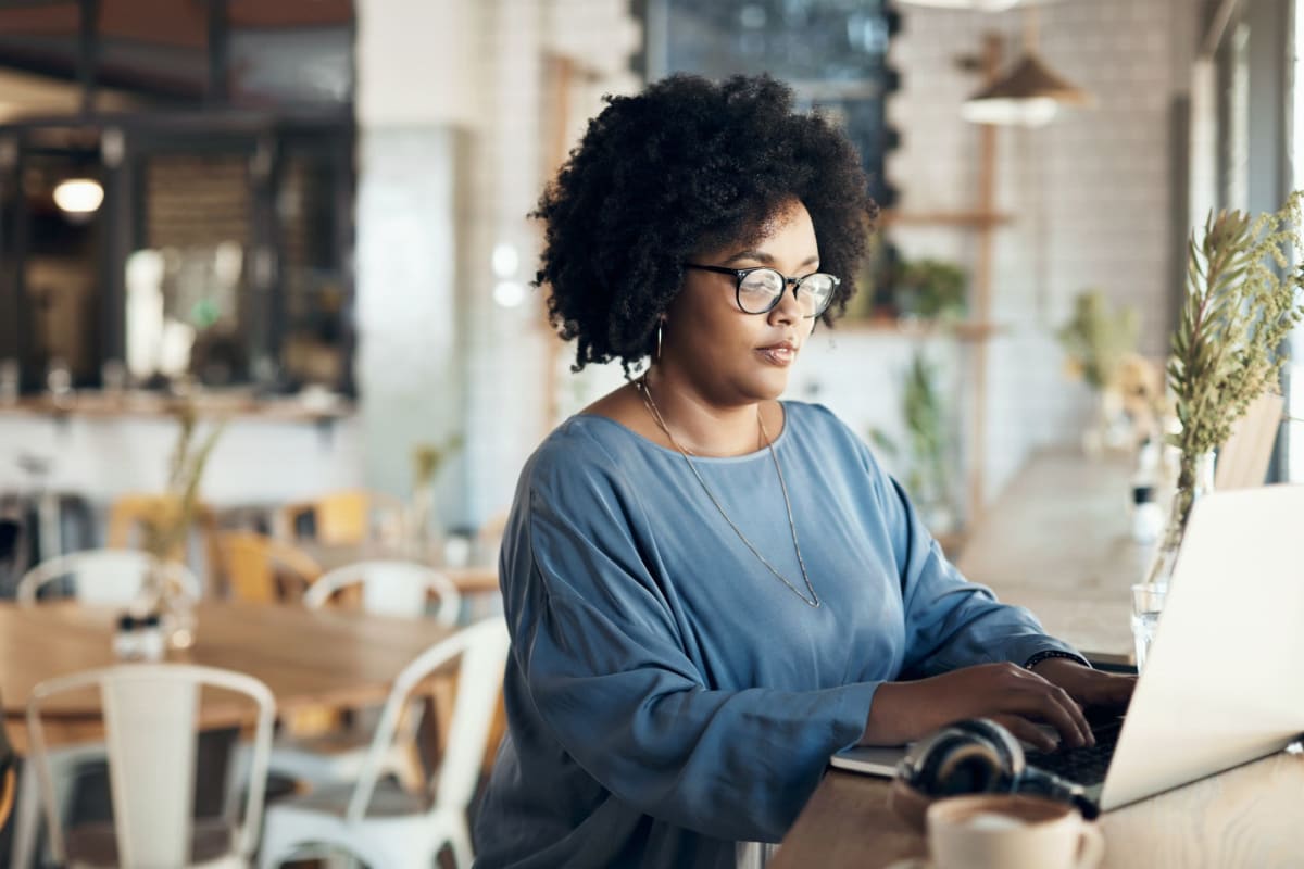 Resident working from a nearby cafe at Parallel 36 at Liberty in Athens, Alabama