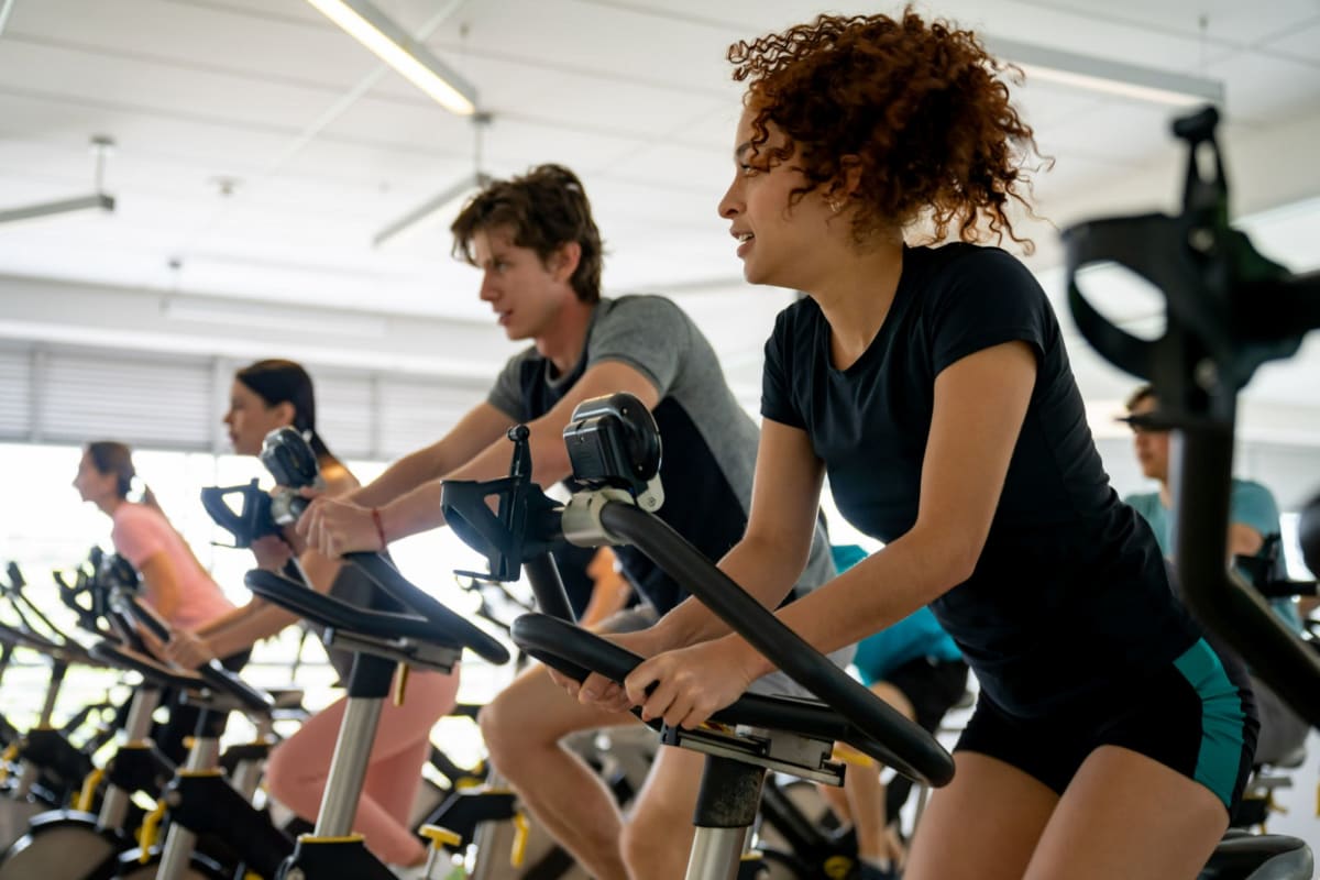 Residents work out in fully equipped fitness center at Kaitlin Court, Los Angeles, California