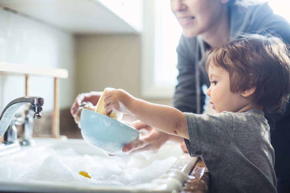 Mother and son washing at Lake Pointe Apartments in Madison, Wisconsin