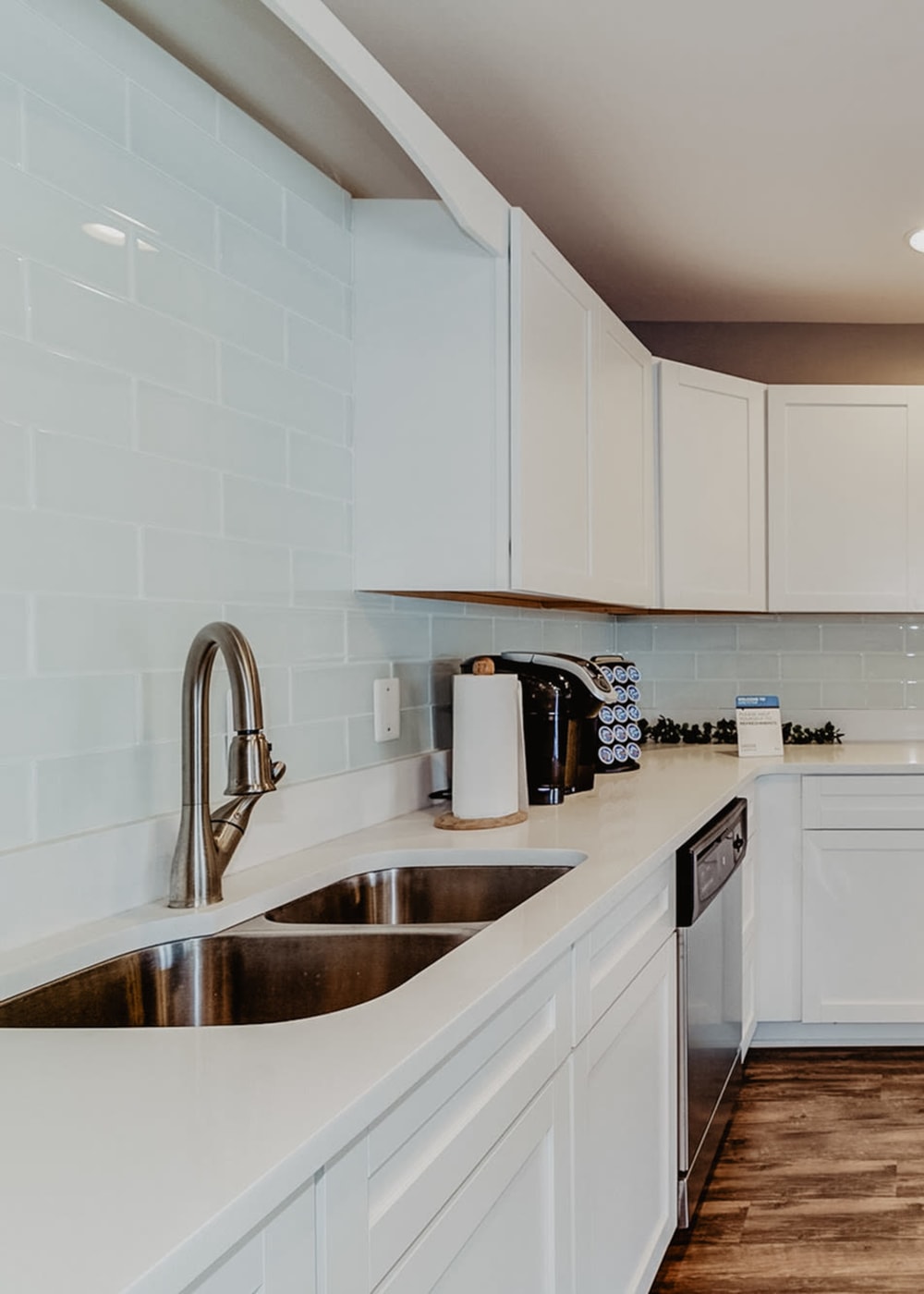 Community clubhouse kitchen with double, stainless steel sink at Stonegate Apartments in Elkton, Maryland