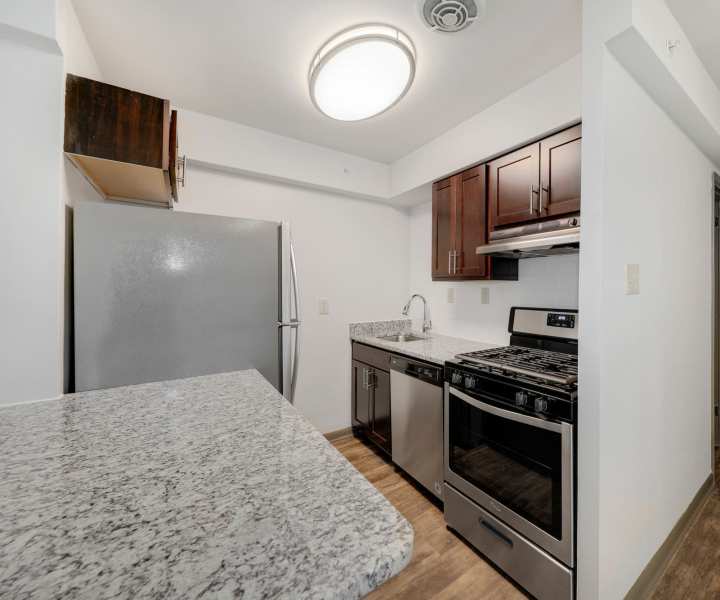 Kitchen with stainless-steel appliances at Parkside Landing Apartments in Rockville, Maryland