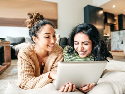 Friends looking over the neighborhood online at Lakeshore Apartments in Concord, California