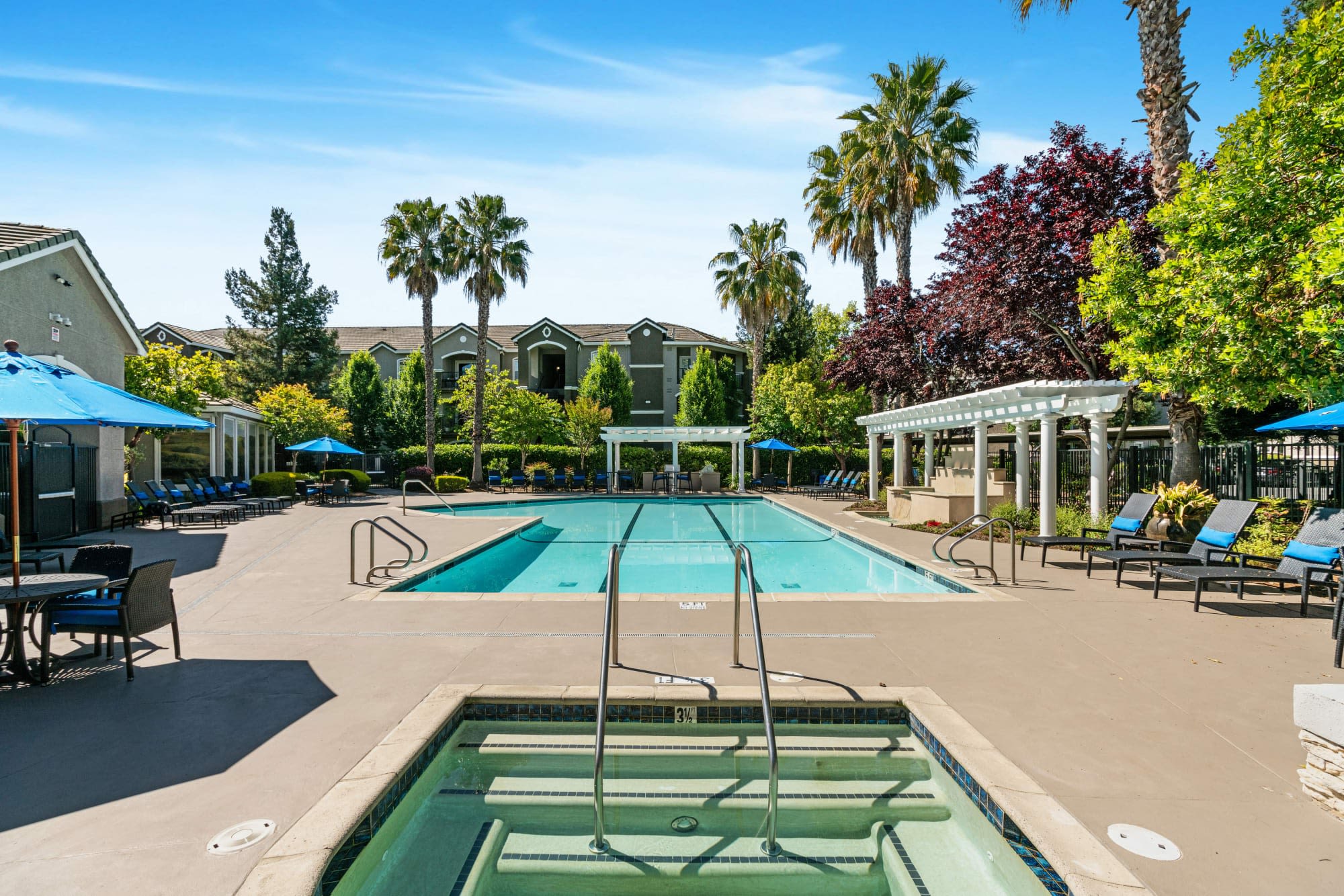 The resort-style swimming pool at Hawthorn Village Apartments in sunny Napa, California