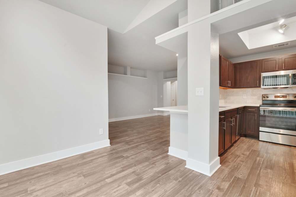 Dining area with view to kitchen at Carrara at Cole in Dallas, Texas