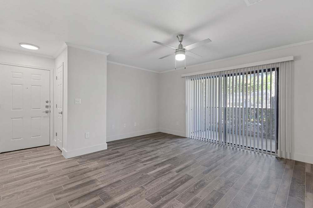Unfurnished living area of an apartment with access to balcony at Seacrest in Katy, Texas