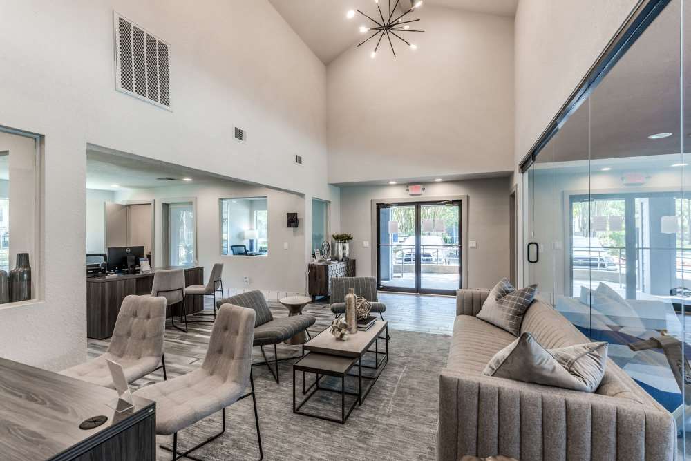 Modern design clubhouse with couch at  Warwick at Westchase in Houston, Texas