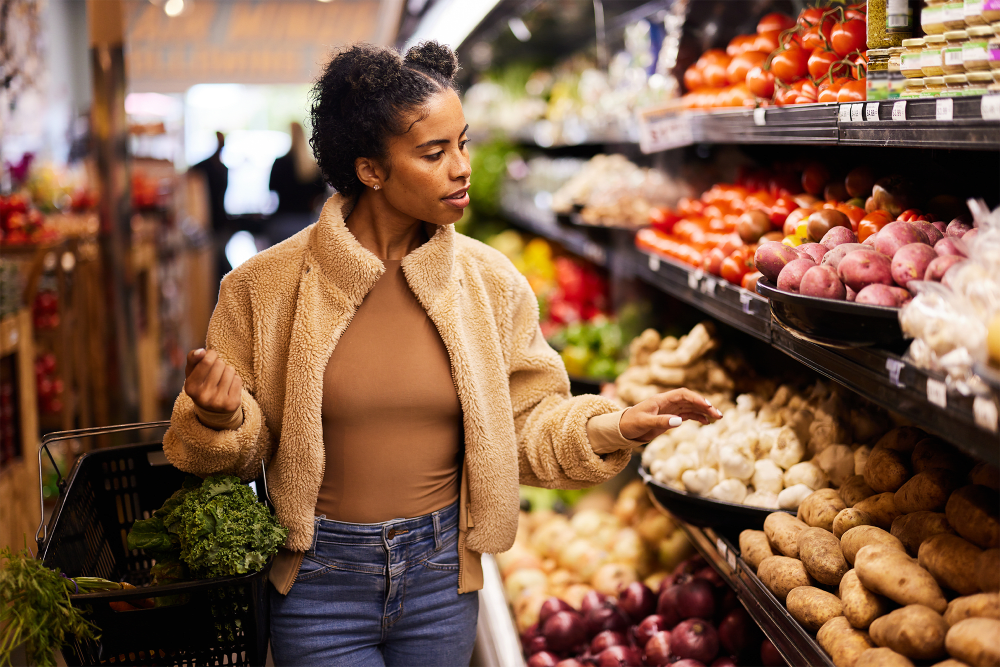 Resident shopping in a grocery store near Gardenbrook Apartments in Columbus, Georgia