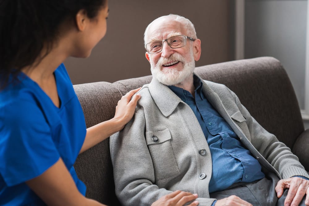 Nurse staff talking with clients at Vista Prairie at Ridgeway in New Ulm, Minnesota