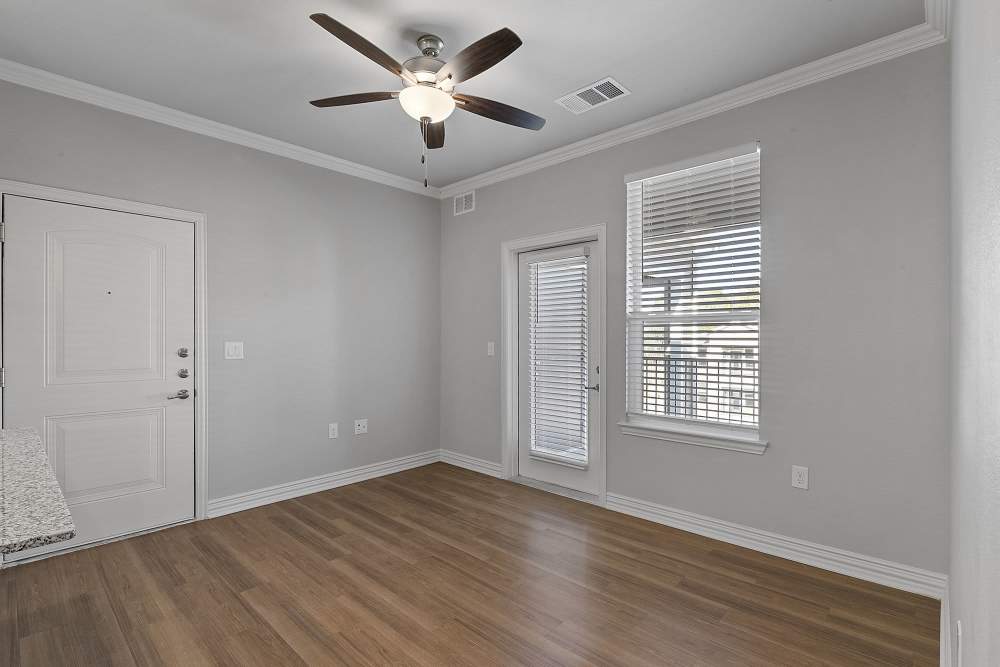 Empty room with wood flooring at Stonebridge Apartment Homes in Lufkin,Texas