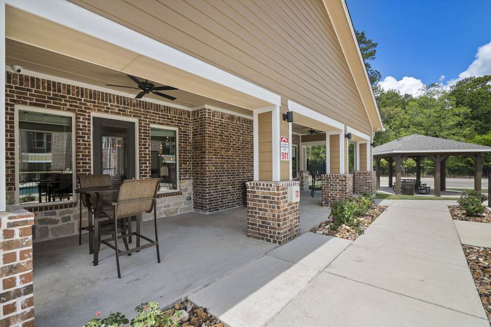 Outdoor patio with chairs at Stonebridge Apartment Homes in Lufkin,Texas