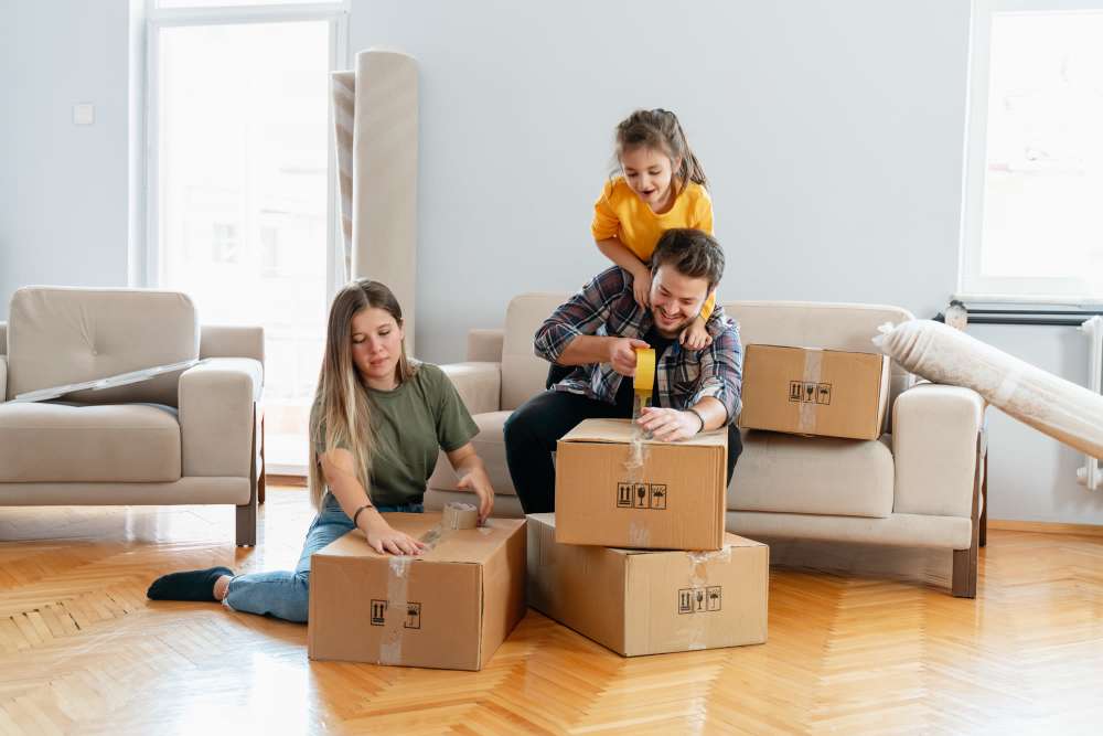 Family packing their storage items near CSI Mini Storage