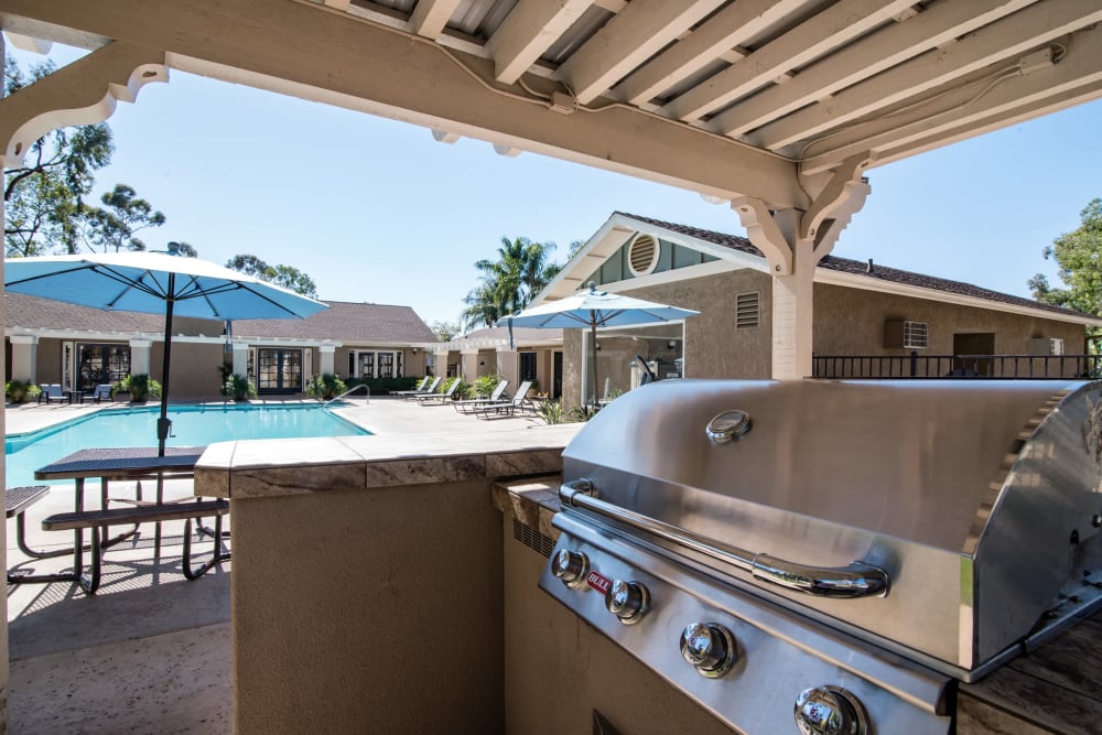 Barbecue by the swimming pool at Lakeview Village Apartments in Spring Valley, California