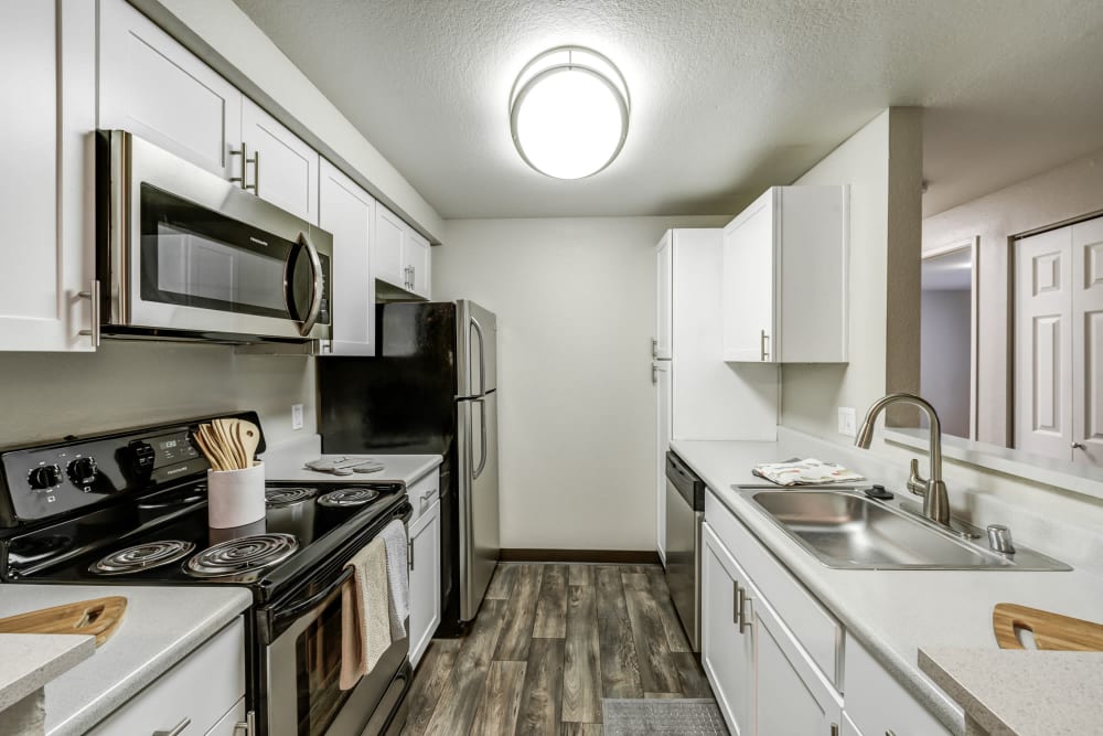 A kitchen with plenty of cabinet space at Olin Fields Apartments in Everett, Washington