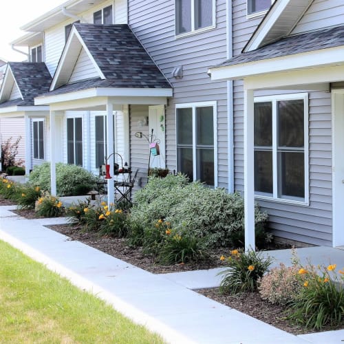 Landscaping in front of townhomes entrances at The Landing of Clinton in Clinton, Iowa